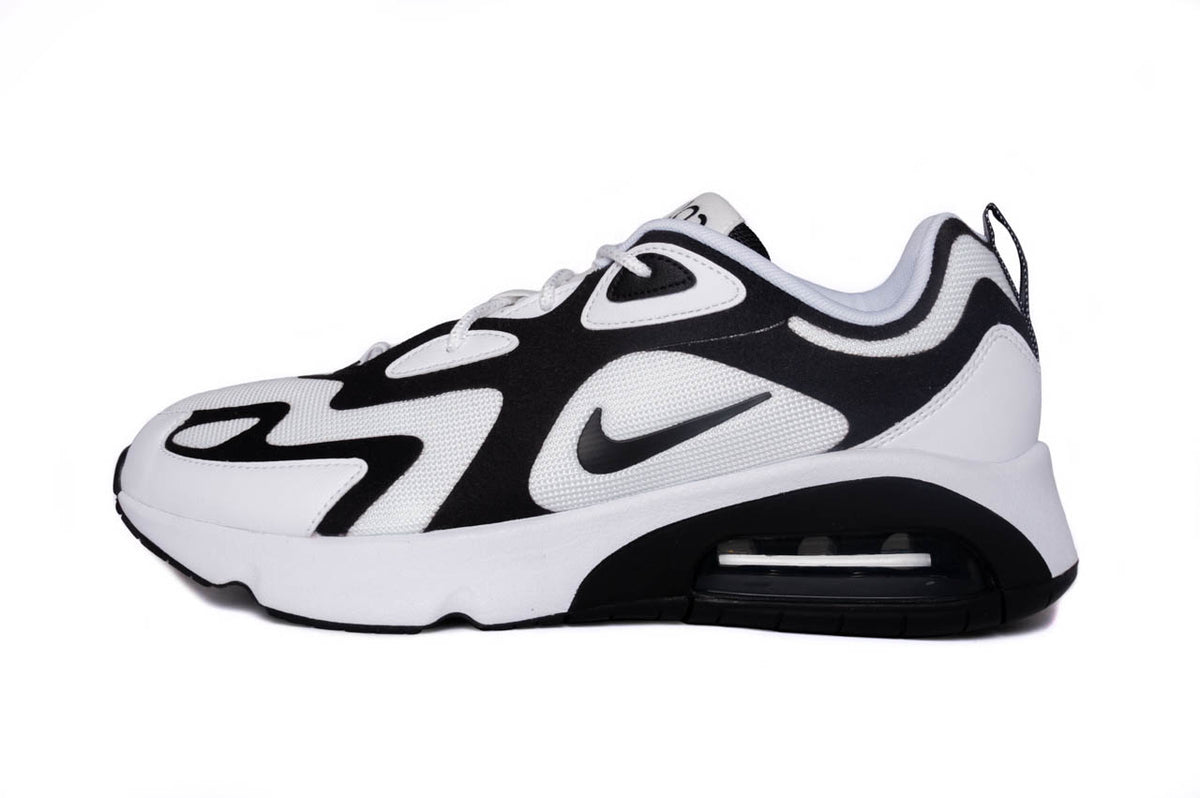 The white and black Nike Air Max 200s from the side angle. Here you can see the white mesh along with the black overlays.